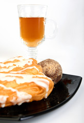 Three cakes and cup of tea