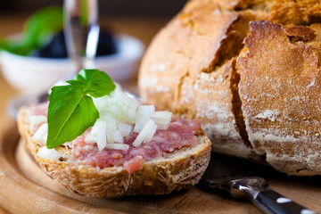 Rustic dinner with sourdough bread and Mettwurst