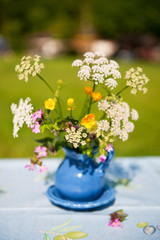 Blue vase with wild flowers