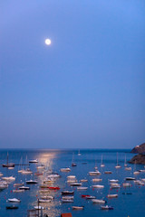 Fototapeta na wymiar Moon rising in the Mediterranean sea over Cadaques