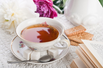 Tea, cookies, the book and peonies