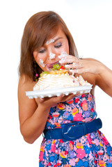 Girl eating cake with his hands