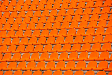 Fototapeta premium Orange empty stadium seats
