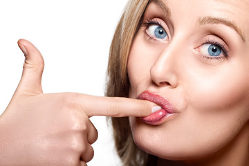 Woman licking her finger