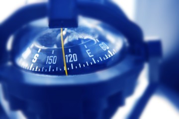boat marine compass in black blue light backlight © lunamarina