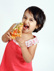 girl enjoying pizza slice