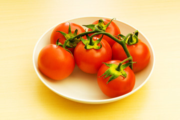 Red tomatoes isolated on the white background