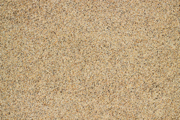 Fototapeta na wymiar Tiny grains of sand macro close up texture.