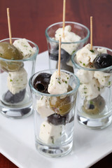 Greek appetizers with black and green olives and feta cheese