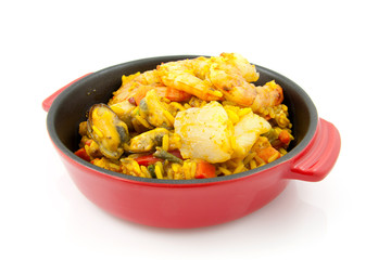 paella with sea food over white background
