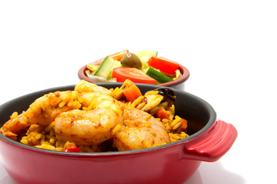 paella with sea food over white background