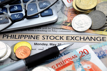 Philippine money on a newspaper stock exchange report