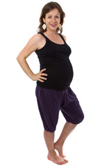 Young pregnant woman in a studio setting isolated over white.