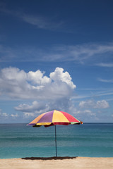 Obraz na płótnie Canvas summer time on beach and umbrella