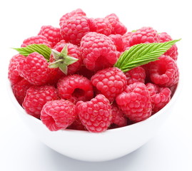 Crockery with  beautiful tempting raspberries.