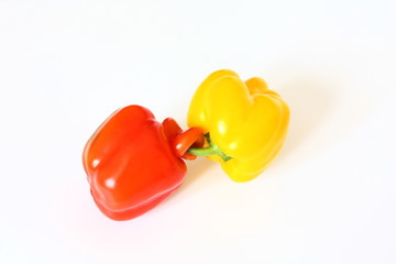 Two bell peppers connected isolated on white