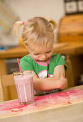 little girl with smoothie