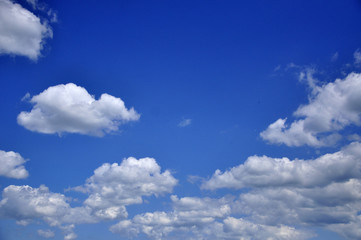white clouds on the blue sky background