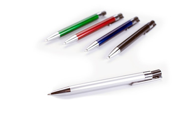 Colored pens on white table