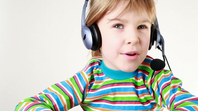 Girl in headset shakes her head and sings