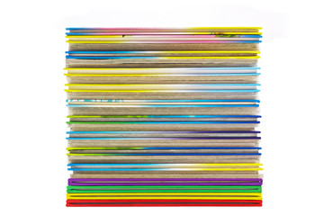 pile of thin multicolored books isolated on white background