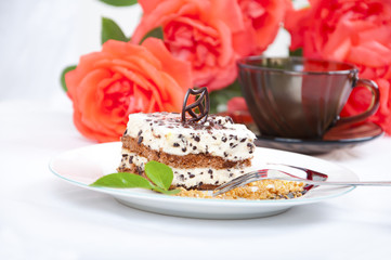 Sweet chocolate dessert with nuts and rose