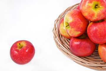 apples in basket isolated on white background