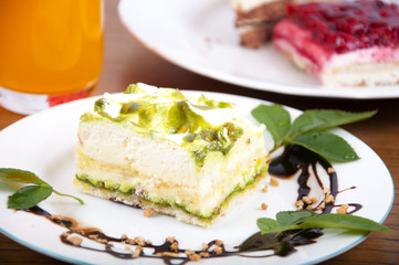 Sweet pistachio dessert with vanilla cream and nuts