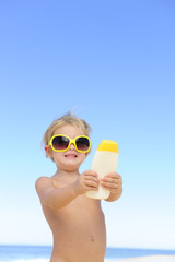 cute child  showing suncream © mangostock