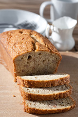 Delicious freshly baked banana bread on wooden board