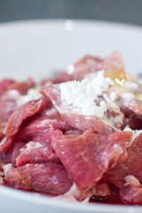 Sliced raw beef marinated with flour