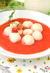 Сurds dumplings (curd, sugar, eggs, flour) in berry sauce.