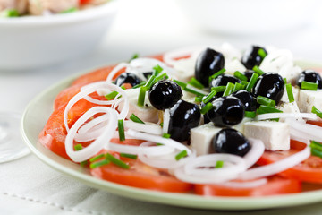Tomato salad with goat cheese and olives