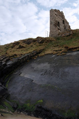 castle tower ruins on a high layered cliff
