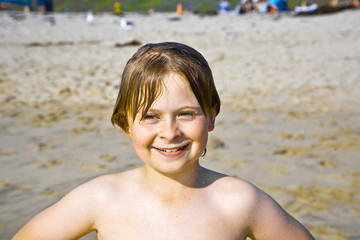 boy plays at the beautiful beach in California