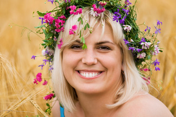 Woman in wreath of flowers