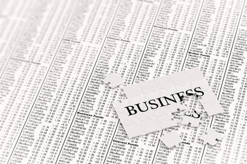 Fototapeta premium Unfinished business puzzle on stock charts