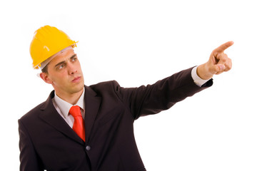 young engineer pointing with is finger in a suit, isolated on wh
