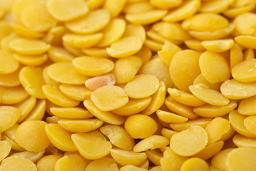 Fototapeta na wymiar Yellow split lentils closeup