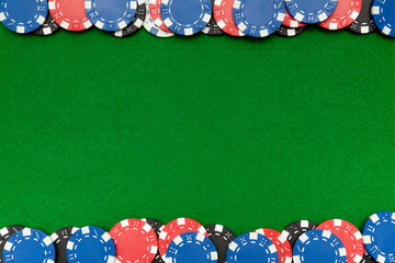 Gambling chips on green felt