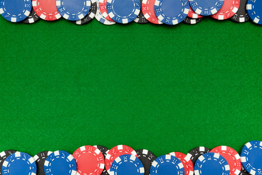 Gambling chips on green felt