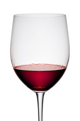 Red wine in a glass, isolated on a white background