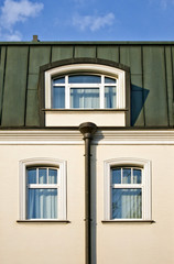 Top of house with windows roof and gutter