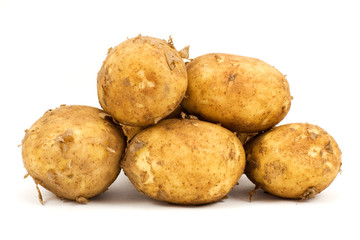 pile of fresh potatoes , isolated on white background