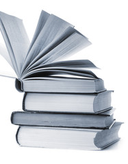 stacked old books are isolated on white