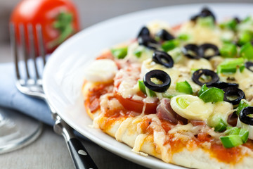 Pizza with cheese and vegetables