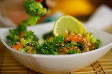Delicious salade with fish, parsley, cucambers and lemon.