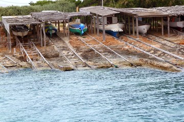 Escalo Formentera boat stranded wooden rails