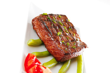 roast meat served with tomato