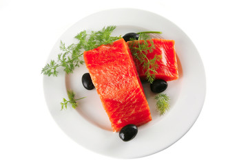 smoked salmon on white plate with olives